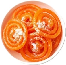 a bowl of orange candis with powdered sugar.jpg